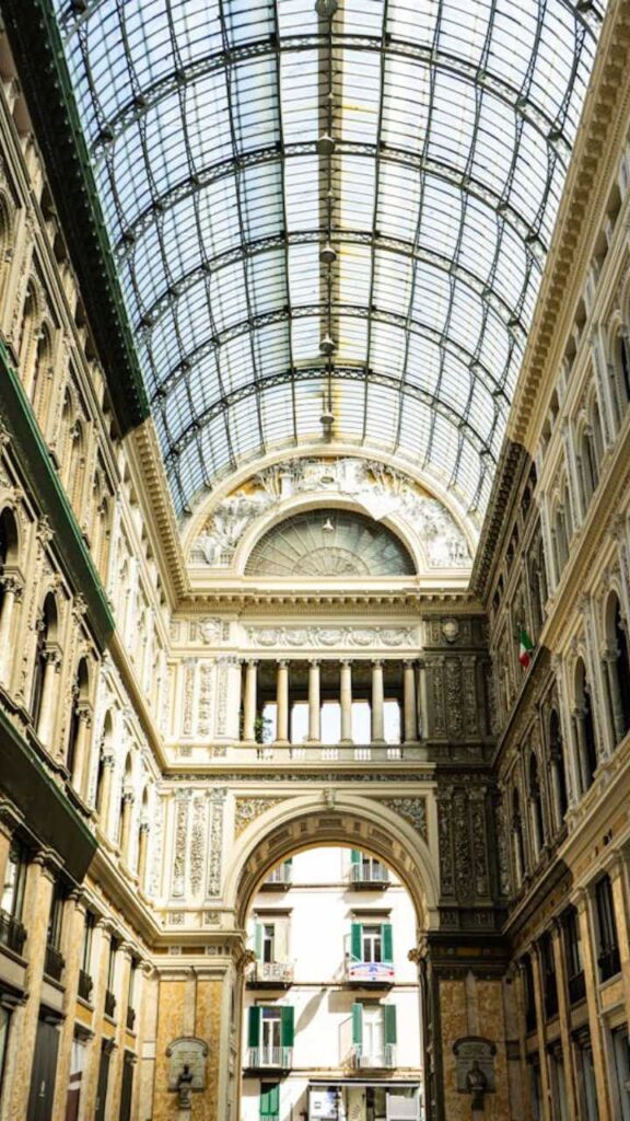 Interior of Galleria Umberto I in Naples with ornate architecture and glass roof