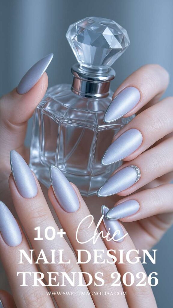 Luxe minimalist nail design trend 2026 — silver chrome almond nails with metallic shine, modern futuristic manicure aesthetic.